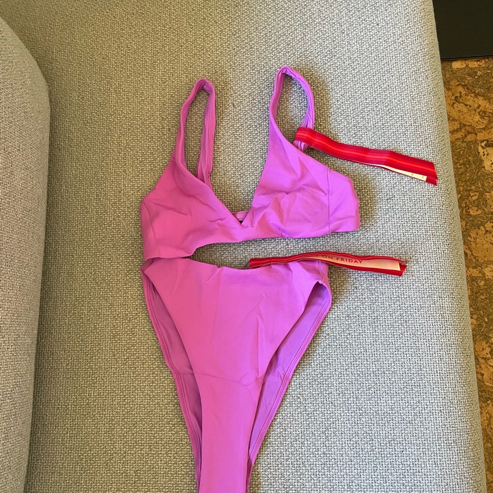Left on Friday set in Punch(Purple)- Plunge top (S) and Throwback bottom (S) NWT